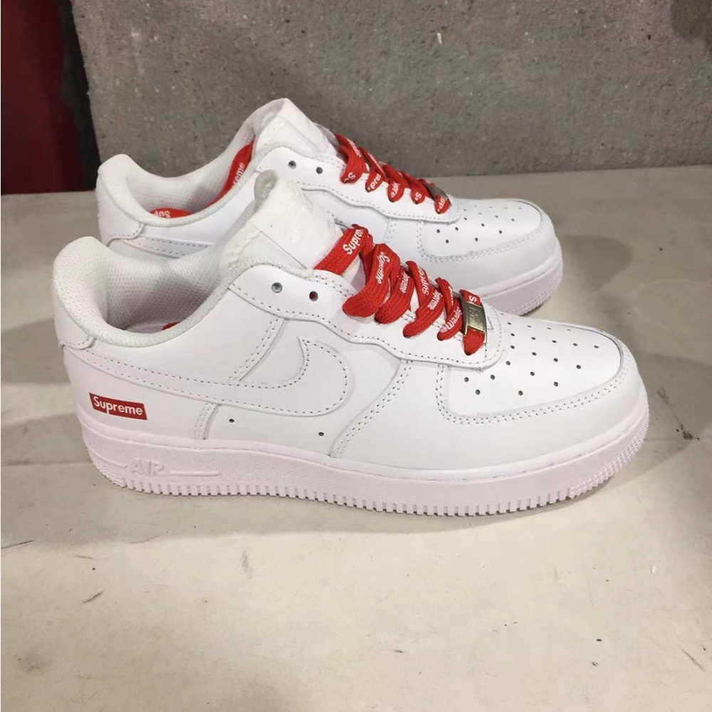 Supreme White Sneakers with Red Highlights